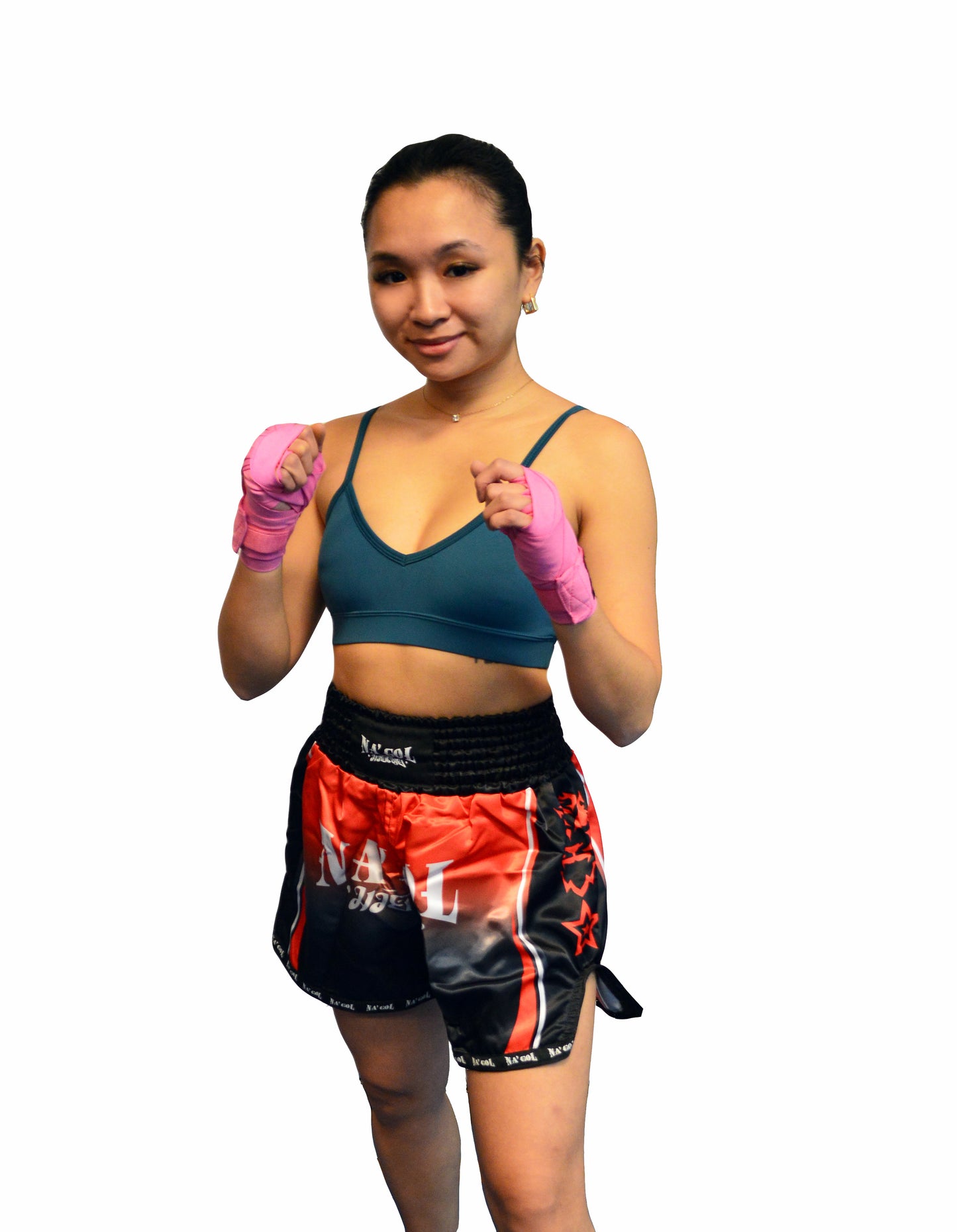 Person wearing boxing hand wraps and shorts on a white background