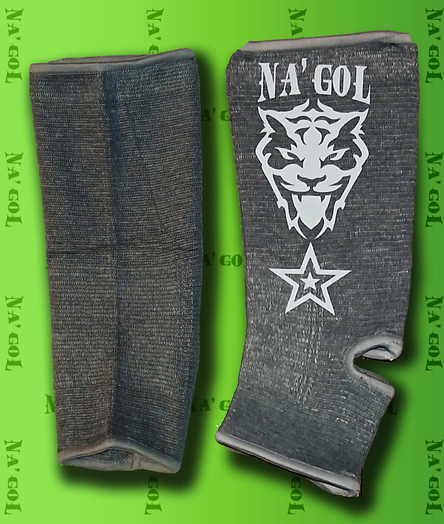 Gray ankle guards with a logo on a green background