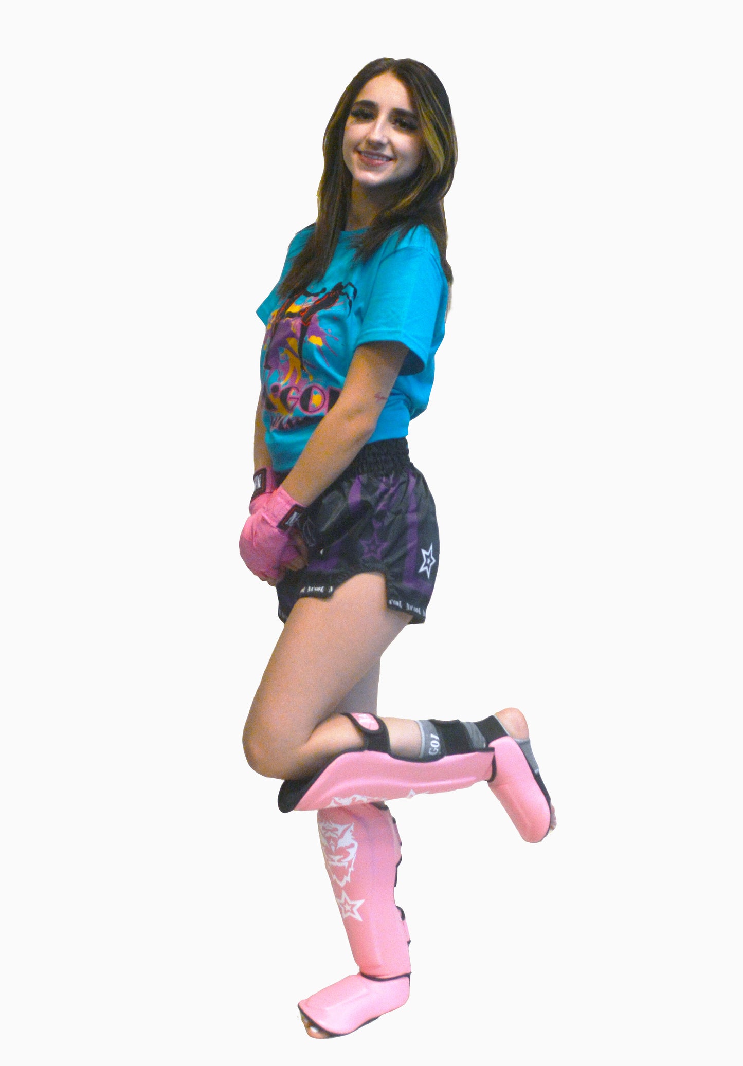 Person wearing a blue shirt, black shorts with pink designs, and pink shin guards on a white background