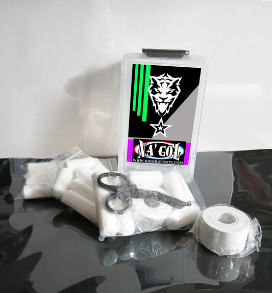 Sports equipment kit with tape, scissors, and packaging on a reflective surface.
